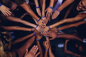 Hands in Circle symbolizing teamwork