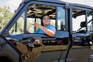 A Native American man waving hello.